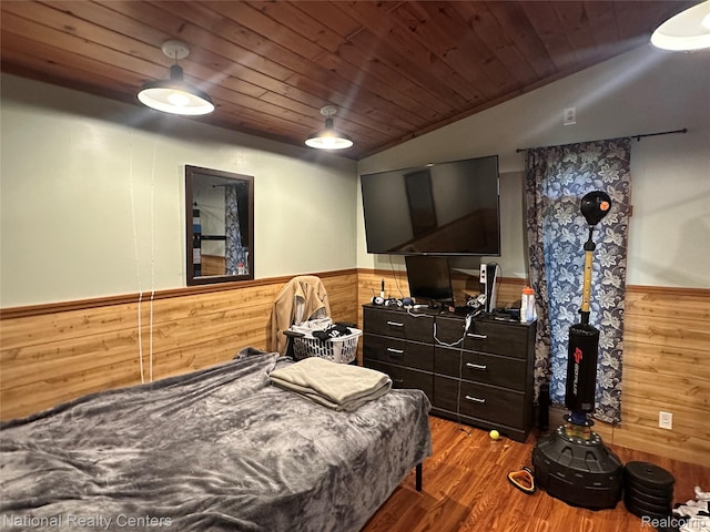 5150 Lafave Rd, Black River, MI 48721 - bedroom with wainscoting, wooden walls, vaulted ceiling, wood ceiling, and wood finished floors