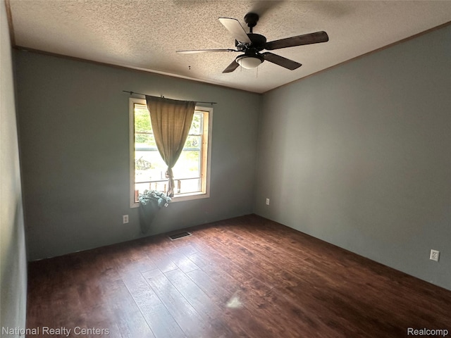 5150 Lafave Rd, Black River, MI 48721 - empty room featuring dark wood finished floors, a ceiling fan, and a textured ceiling