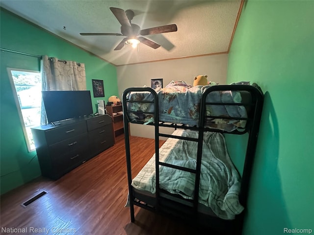 5150 Lafave Rd, Black River, MI 48721 - bedroom with lofted ceiling, wood finished floors, a textured ceiling, and ceiling fan