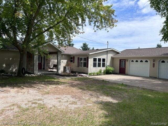 5150 Lafave Rd, Black River, MI 48721 - view of front of house with an attached garage and concrete driveway