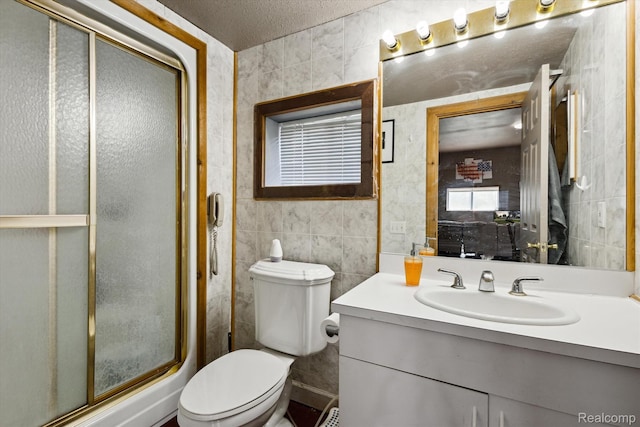 2536 Meridian Rd, Lewiston, MI 49756 - full bath with tile walls, a stall shower, vanity, and a textured ceiling