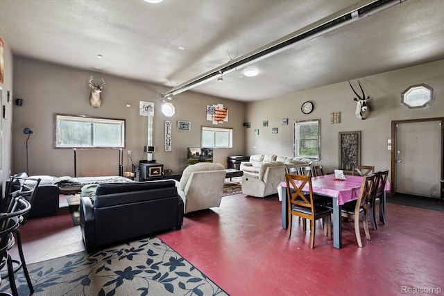 2536 Meridian Rd, Lewiston, MI 49756 - living area featuring a wood stove and concrete flooring