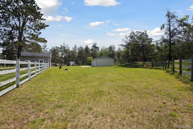 2536 Meridian Rd, Lewiston, MI 49756 - view of yard featuring a storage unit