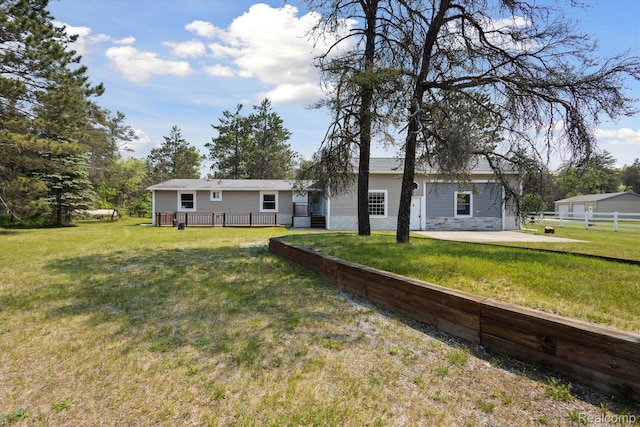 2536 Meridian Rd, Lewiston, MI 49756 - back of property featuring a deck and a patio