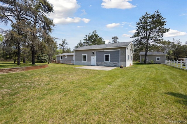 2536 Meridian Rd, Lewiston, MI 49756 - rear view of property with a patio
