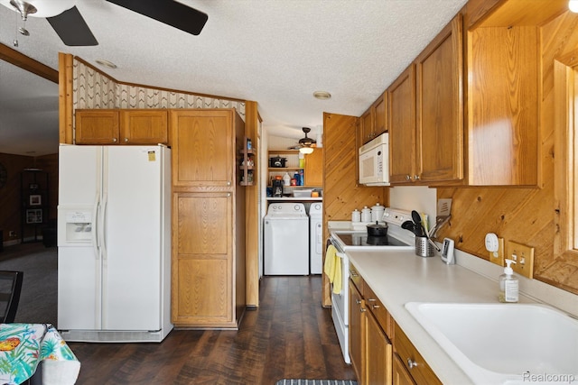2536 Meridian Rd, Lewiston, MI 49756 - kitchen featuring a ceiling fan, white appliances, independent washer and dryer, brown cabinets, and lofted ceiling