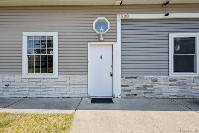 2536 Meridian Rd, Lewiston, MI 49756 - view of exterior entry with stone siding