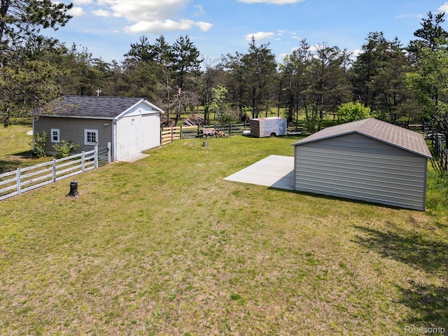 2536 Meridian Rd, Lewiston, MI 49756 - view of yard with a patio, a storage shed, and view of scattered trees