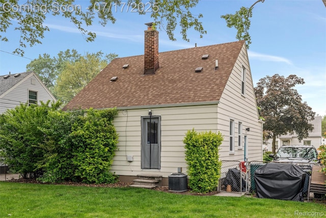 518 Roth Blvd, Clawson, MI 48017 - rear view of house featuring a chimney, roof with shingles, and entry steps