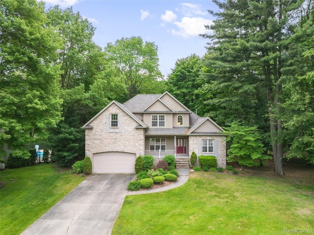 3409 Ancient Dr, Port Huron, MI 48060 - traditional-style home with a garage, a front lawn, driveway, stone siding, and covered porch