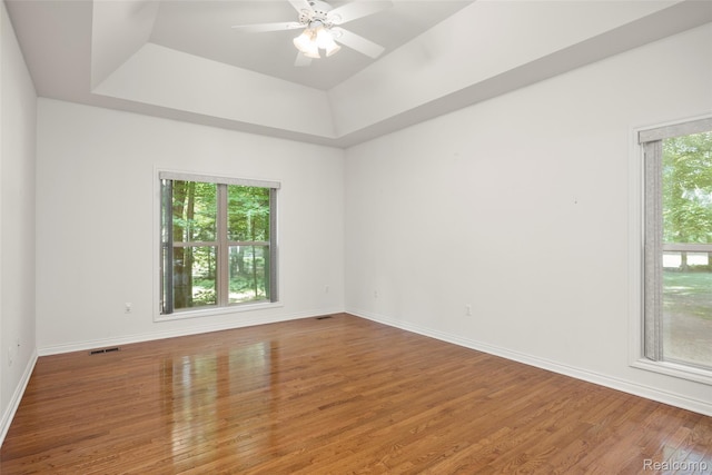 3409 Ancient Dr, Port Huron, MI 48060 - empty room featuring a raised ceiling, wood finished floors, and a ceiling fan