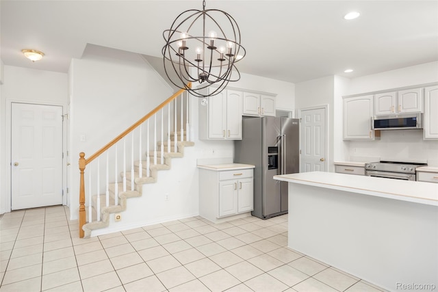 3409 Ancient Dr, Port Huron, MI 48060 - kitchen featuring stainless steel appliances, light countertops, white cabinetry, a chandelier, and recessed lighting