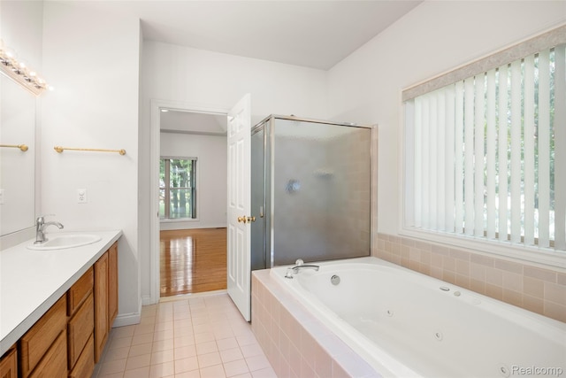 3409 Ancient Dr, Port Huron, MI 48060 - bathroom featuring vanity, a tub with jets, tile patterned floors, and a shower stall