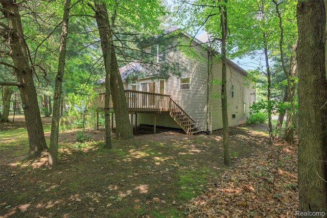 3409 Ancient Dr, Port Huron, MI 48060 - rear view of house featuring a wooden deck, stairs, and crawl space