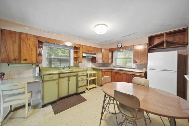 538 S Jackson St, Hanover, MI 49241 - kitchen with open shelves, freestanding refrigerator, a sink, and light countertops