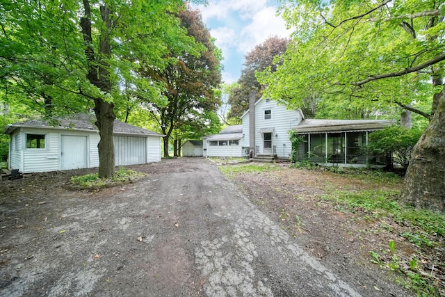 538 S Jackson St, Hanover, MI 49241 - view of front of property featuring a sunroom and an outdoor structure