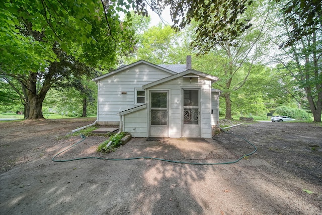 538 S Jackson St, Hanover, MI 49241 - back of property with a chimney