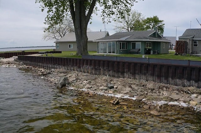 5547 Circle Dr, Standish, MI 48658 - back of house featuring a water view and a yard