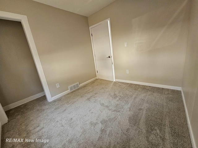 3705 Gratiot Ave, Flint, MI 48503 - unfurnished bedroom with carpet flooring and baseboards