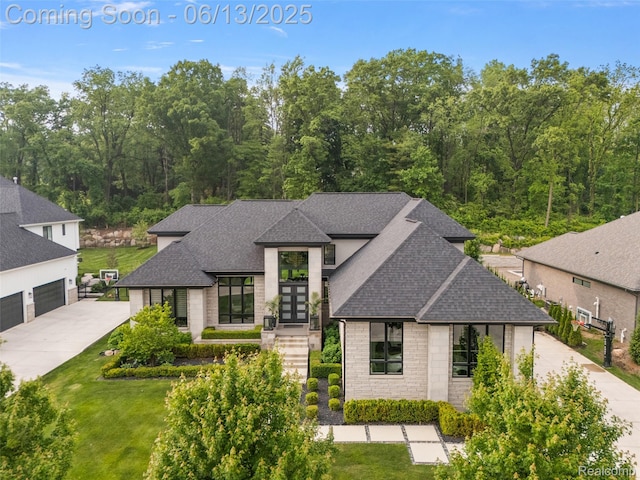 212 Enclave Ct, Rochester Hills, MI 48306 - view of front of property featuring roof with shingles, french doors, stone siding, driveway, and a front yard