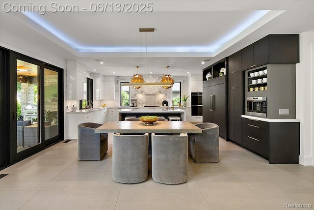 212 Enclave Ct, Rochester Hills, MI 48306 - dining area with a raised ceiling