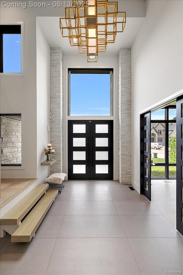 212 Enclave Ct, Rochester Hills, MI 48306 - tiled entryway featuring a high ceiling, french doors, and healthy amount of natural light