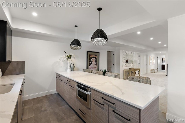 212 Enclave Ct, Rochester Hills, MI 48306 - kitchen featuring a tray ceiling, stainless steel oven, a peninsula, baseboards, and recessed lighting