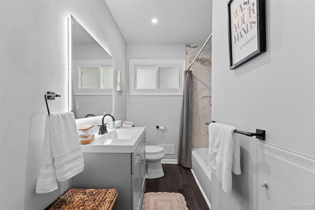 30112 Matthew St, Westland, MI 48186 - full bathroom featuring toilet, vanity, wood finished floors, shower / bathtub combination with curtain, and baseboards