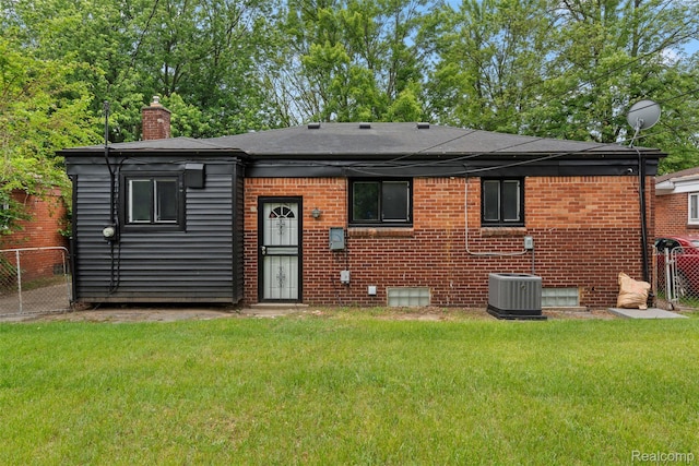 30112 Matthew St, Westland, MI 48186 - back of house featuring a chimney, brick siding, cooling unit, and a shingled roof