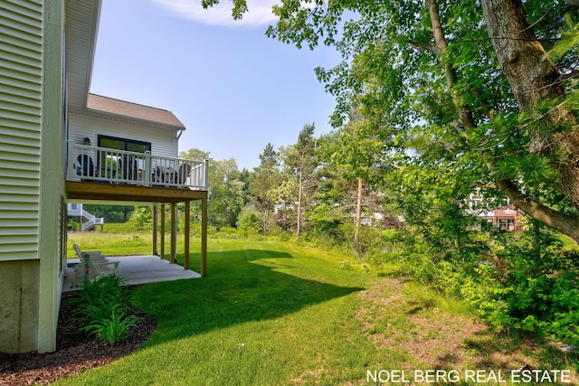 18153 Newgate Ln, Spring Lake, MI 49456 - view of green lawn with a patio and a wooden deck