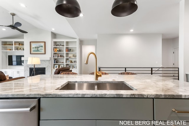 18153 Newgate Ln, Spring Lake, MI 49456 - kitchen with gray cabinetry, a sink, open floor plan, light stone countertops, and lofted ceiling