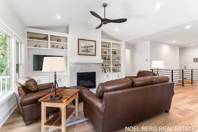 18153 Newgate Ln, Spring Lake, MI 49456 - living area with healthy amount of natural light, light wood finished floors, lofted ceiling, and recessed lighting