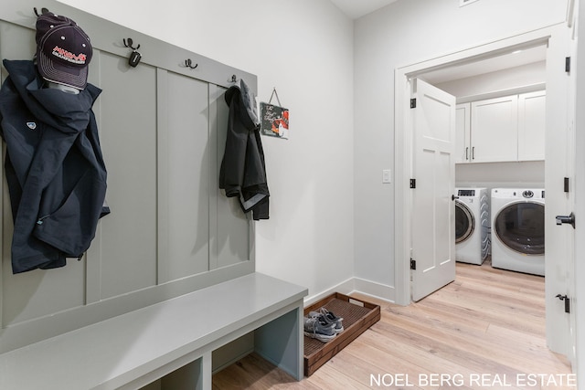 18153 Newgate Ln, Spring Lake, MI 49456 - mudroom with separate washer and dryer, light wood-style floors, and baseboards