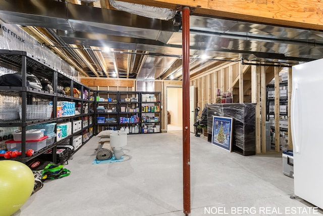 18153 Newgate Ln, Spring Lake, MI 49456 - unfinished below grade area featuring freestanding refrigerator