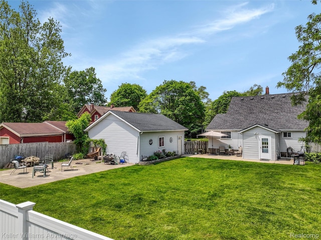 2931 4th St, Trenton, MI 48183 - fenced backyard featuring a patio and an outdoor structure