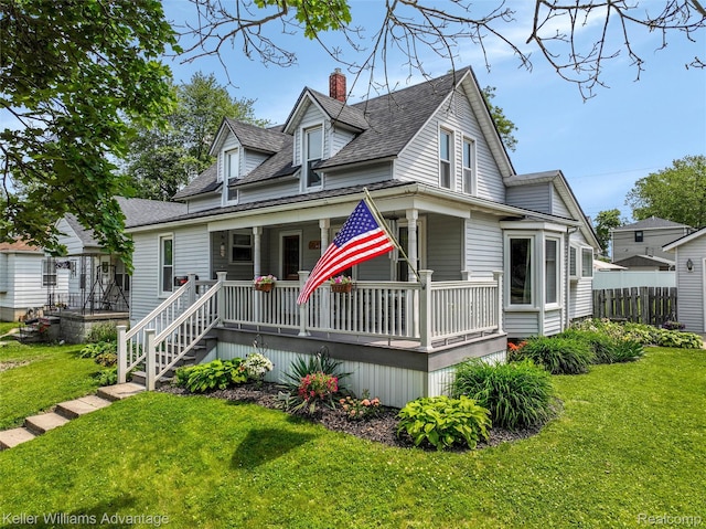 2931 4th St, Trenton, MI 48183 - view of front of home with a porch, a chimney, and a shingled roof