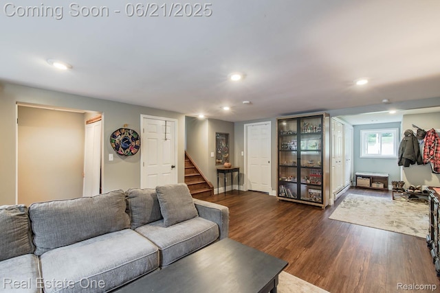 1400 W Predmore Rd, Oakland, MI 48363 - living room with stairway, dark wood-type flooring, recessed lighting, and a baseboard heating unit