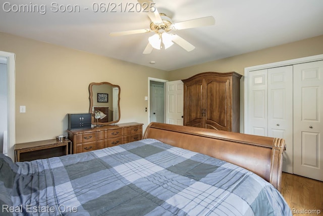 1400 W Predmore Rd, Oakland, MI 48363 - bedroom with a closet, a ceiling fan, and wood finished floors