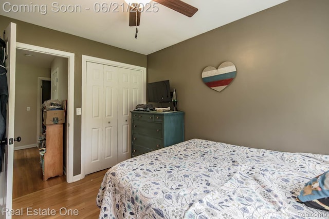 1400 W Predmore Rd, Oakland, MI 48363 - bedroom with wood finished floors, a closet, and a ceiling fan