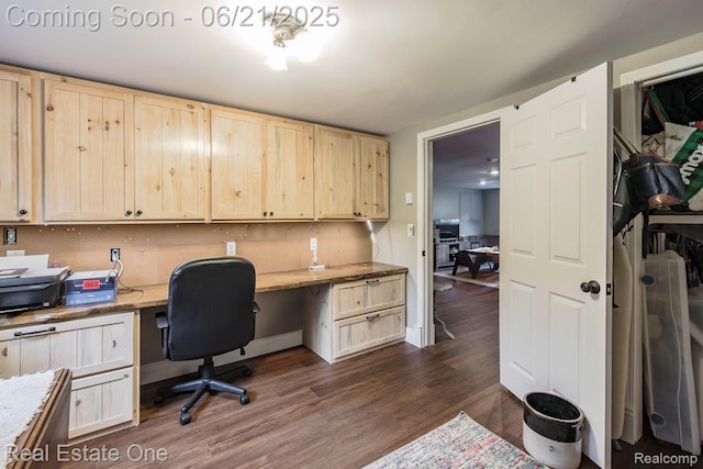 1400 W Predmore Rd, Oakland, MI 48363 - home office with built in desk and dark wood-type flooring