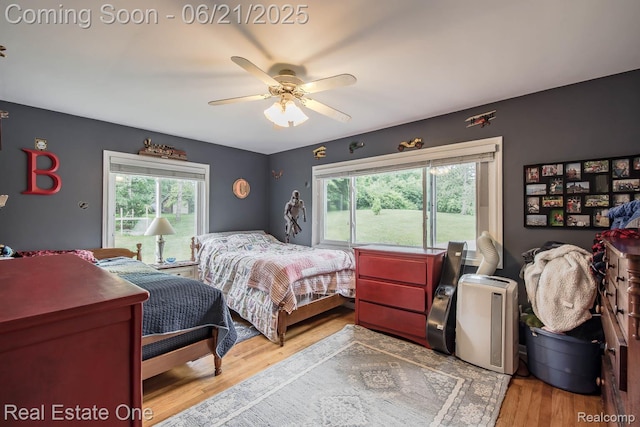 1400 W Predmore Rd, Oakland, MI 48363 - bedroom featuring multiple windows, wood finished floors, and a ceiling fan