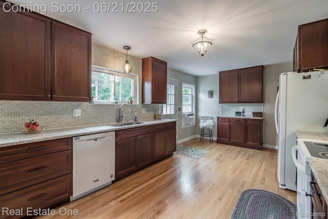 1400 W Predmore Rd, Oakland, MI 48363 - kitchen featuring white appliances, tasteful backsplash, light wood-style flooring, decorative light fixtures, and a chandelier