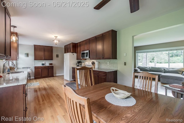 1400 W Predmore Rd, Oakland, MI 48363 - dining room featuring a ceiling fan and light wood-style flooring