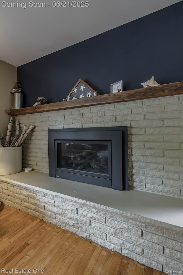 1400 W Predmore Rd, Oakland, MI 48363 - detailed view of a fireplace and wood finished floors