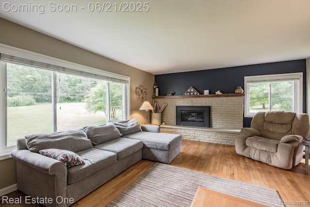 1400 W Predmore Rd, Oakland, MI 48363 - living area with wood finished floors and a fireplace