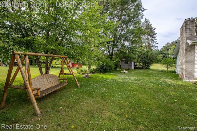 1400 W Predmore Rd, Oakland, MI 48363 - view of grassy yard featuring an outbuilding