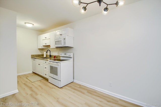 810 Plate St Unit 103, Rochester, MI 48307 - kitchen with white appliances, a sink, light wood-type flooring, baseboards, and white cabinets