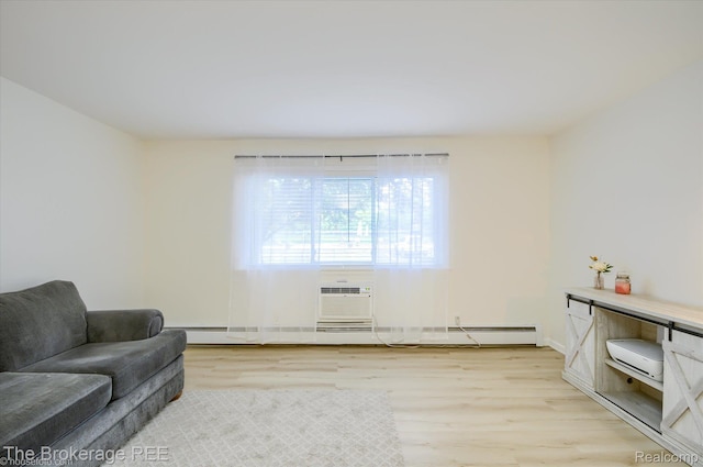 810 Plate St Unit 103, Rochester, MI 48307 - living room with light wood finished floors, a wall mounted AC, and baseboards