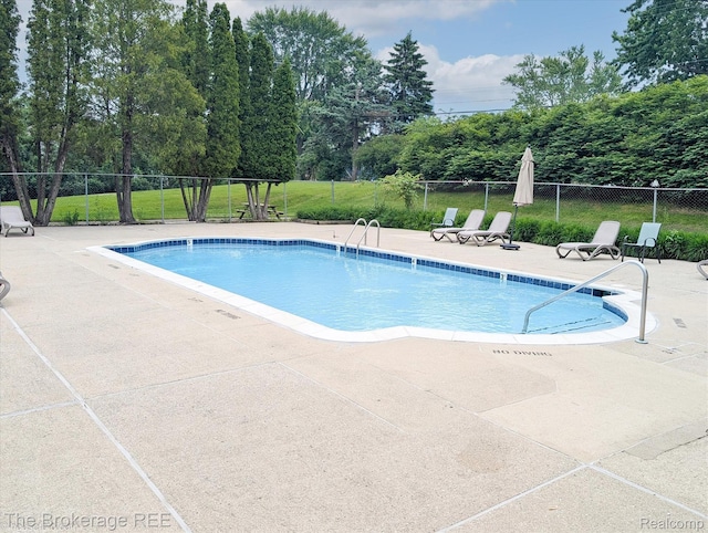 810 Plate St Unit 103, Rochester, MI 48307 - community pool featuring a patio area and view of scattered trees