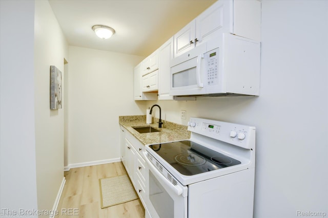 810 Plate St Unit 103, Rochester, MI 48307 - kitchen with white appliances, a sink, light wood-style floors, white cabinetry, and baseboards